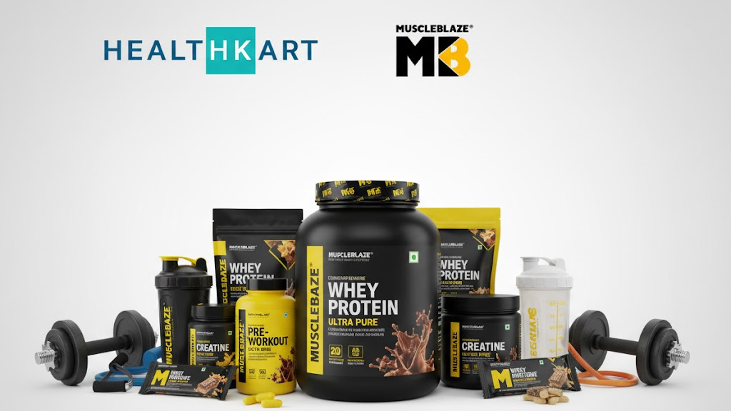 HealthKart and MuscleBlaze products displayed together highlighting premium nutrition and fitness supplements.